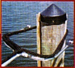 Dock Boy Being Placed Over a Piling